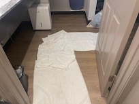 Towels laid on floor to keep feet clean after shower