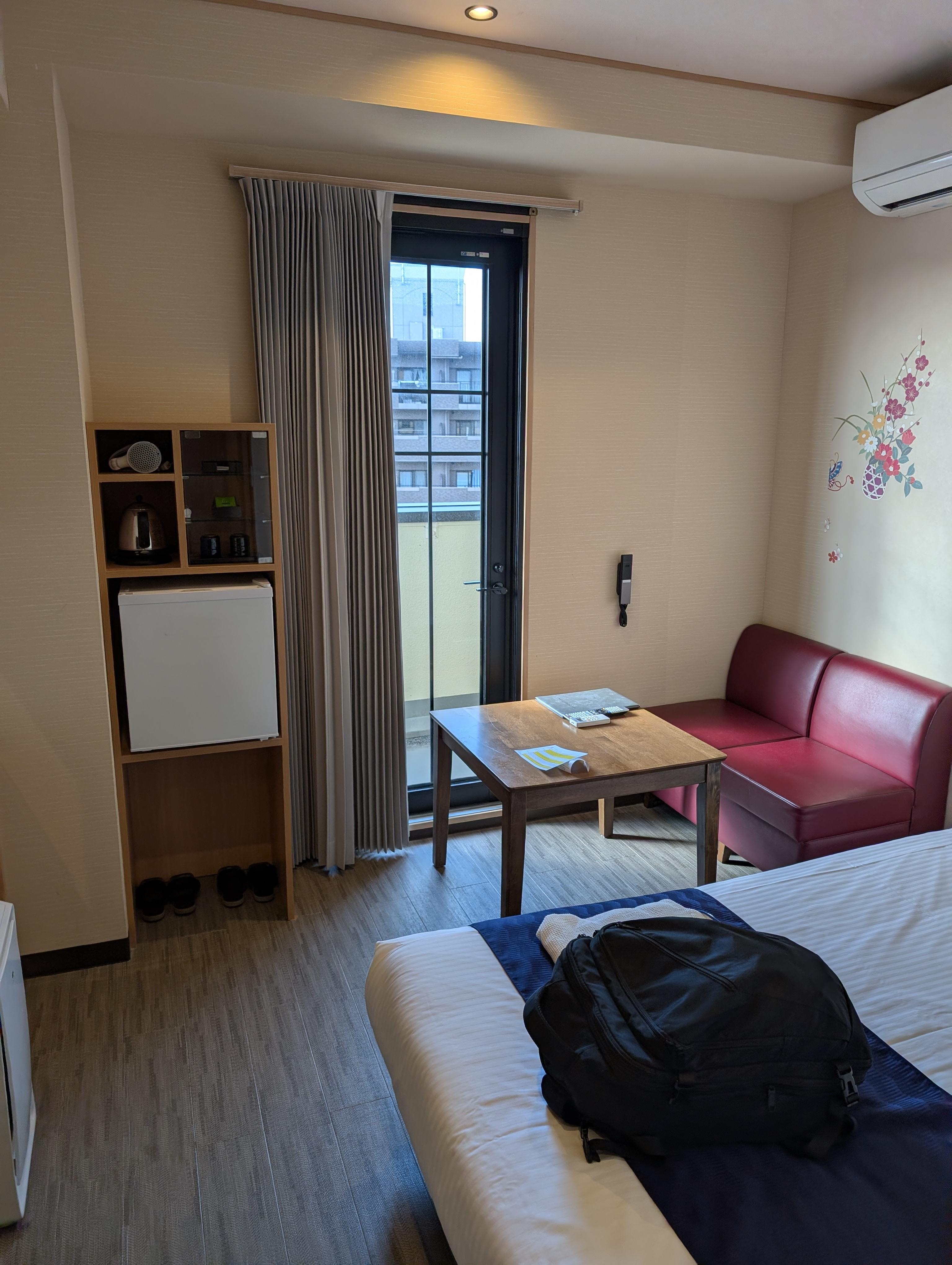 It's a pretty cute room.  TV's on the left; the door leads to the balcony.