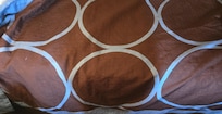 Stains on the other bedspread of the room.