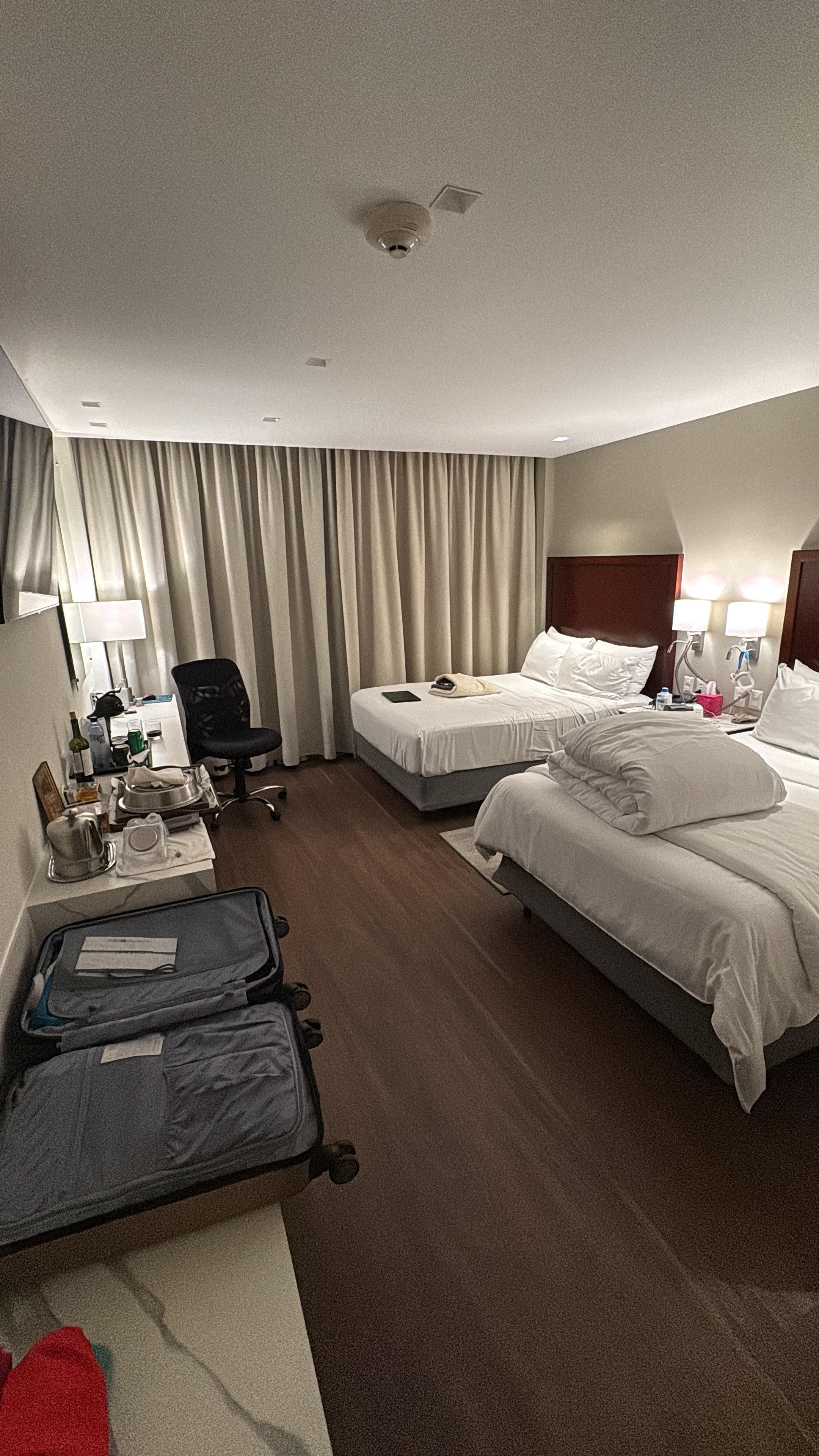 Spacious room with comfy beds and the best part is the large console for luggage and travel items