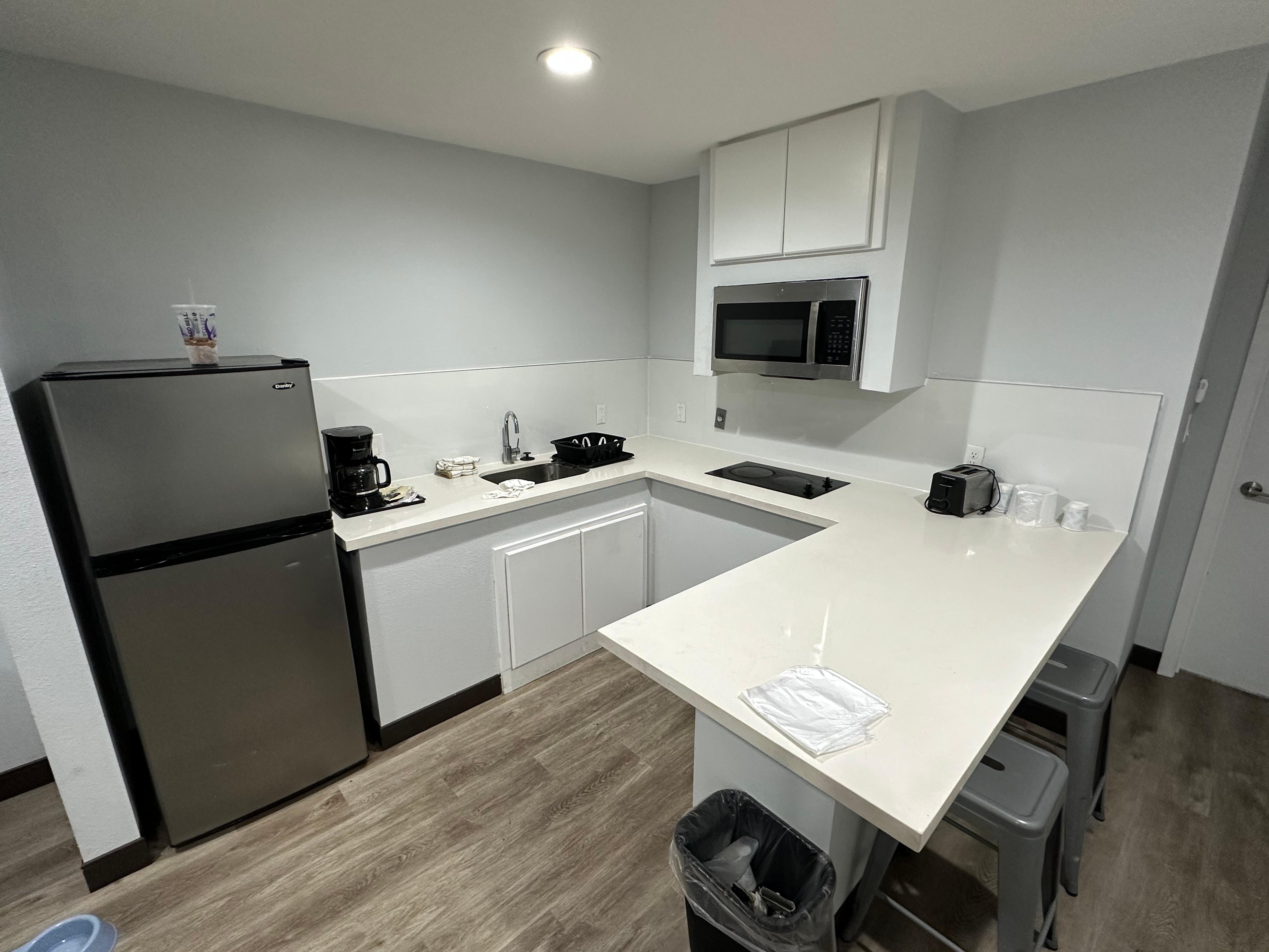 The kitchen looks nice, but the stove doesn’t work and there are no utensils at all. There’s also no cabinets to put anything in.