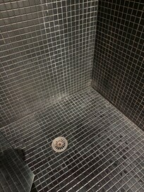 Scum on the shower walls.