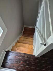 Looking down stairs to 2nd floor.