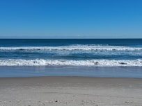 Beautiful clean Beach right outside the hotel near the pool and Bar
