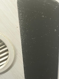 Fan blade showing level of dust accumulation for a place charging $125 cleaning fee