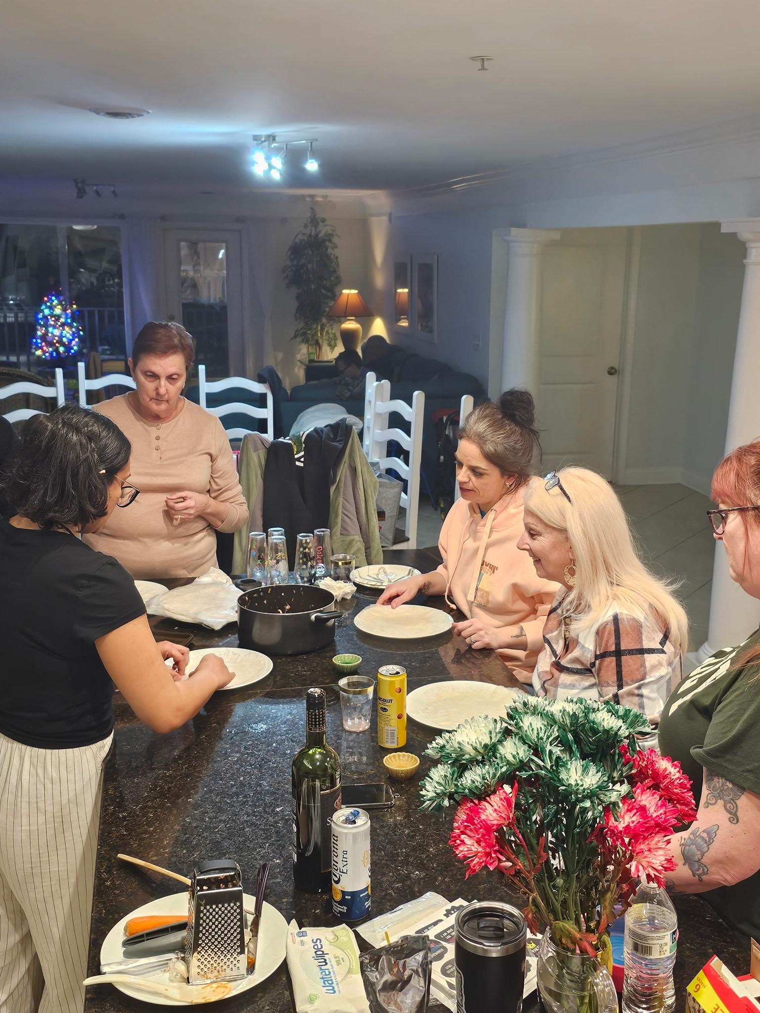 The ladies learning how to make lumpia