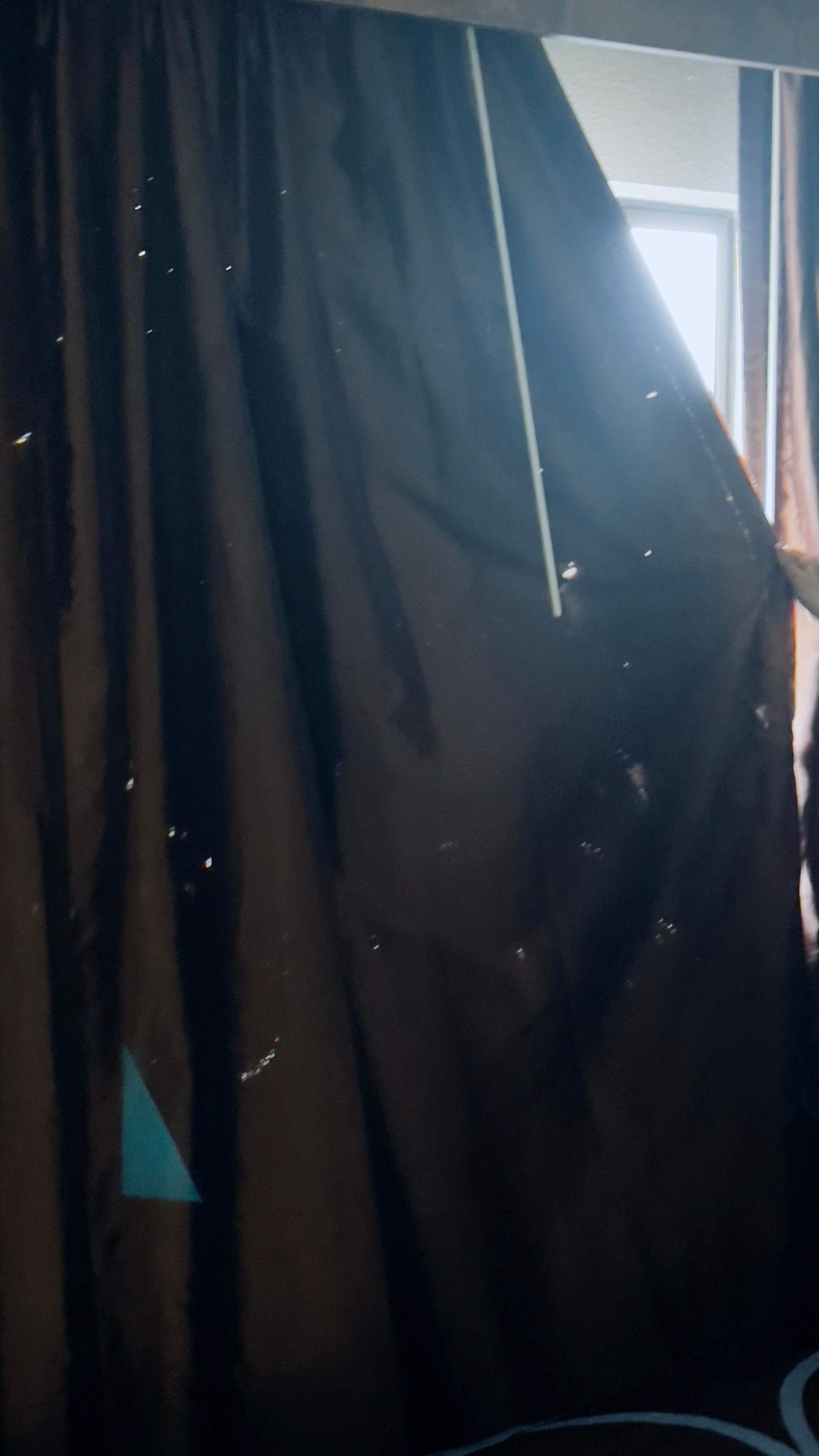 All the white spots are burn wholes in the curtain