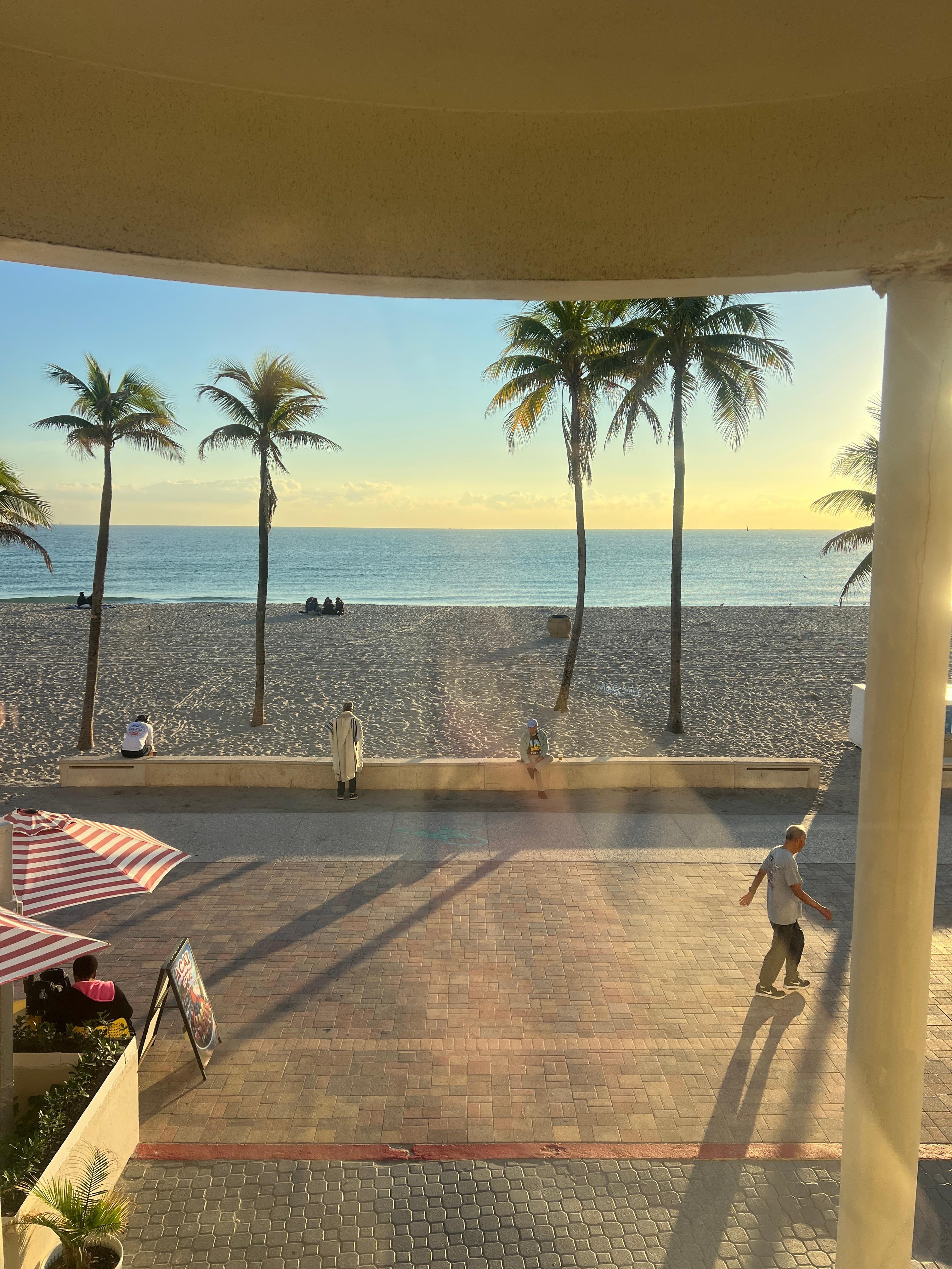 View stepping out of beach front lobby doors 