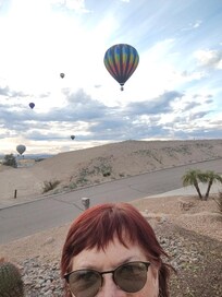 Me in the front yard, with balloons coming our way!