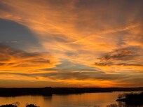 Great view of the sunset overlooking the water.