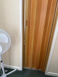 Plastic door into toilet not closing and was insufferable.