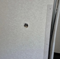 Hole where door knob went thru