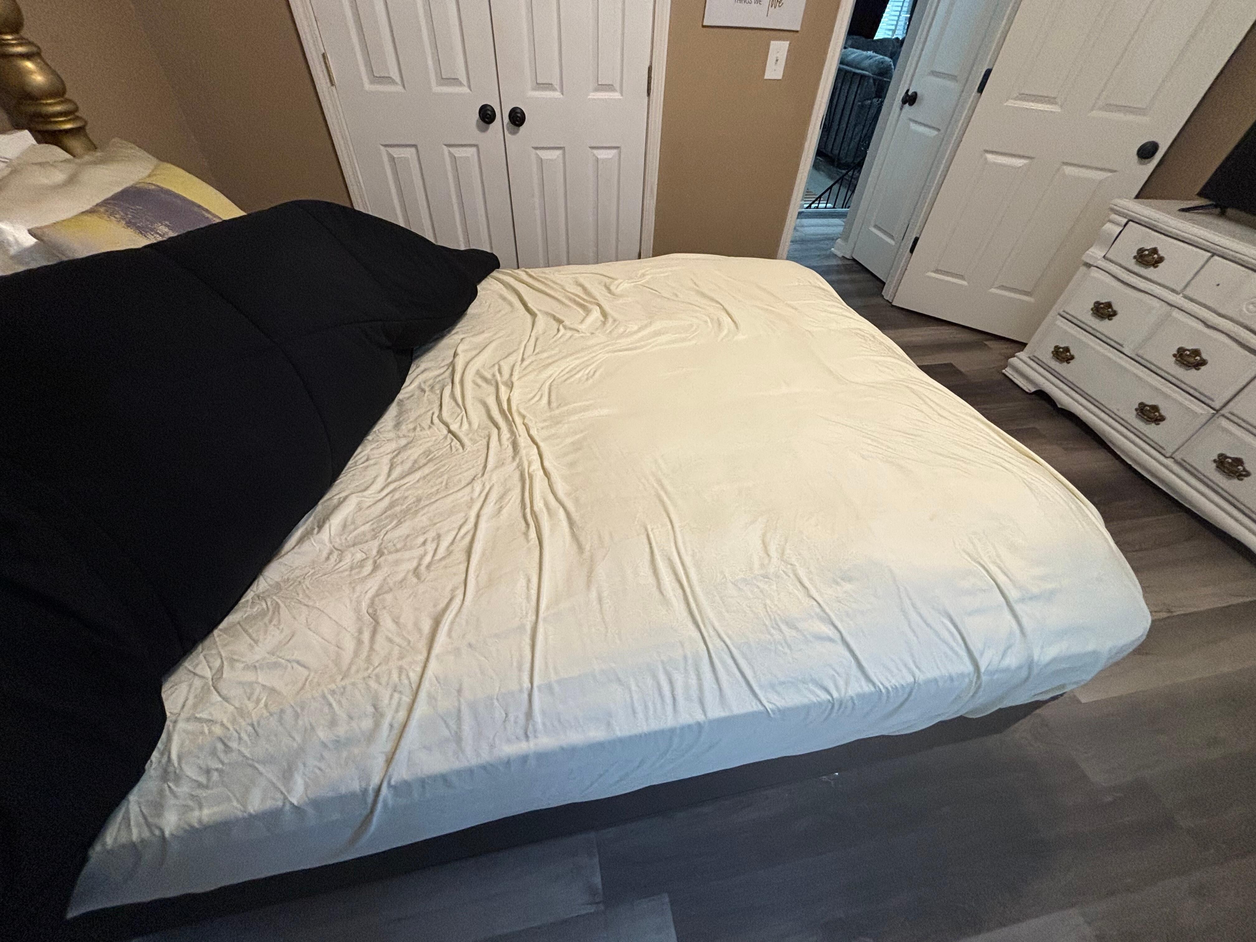Bed after moving the comforter back