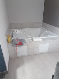 Hot tub ! I get it a Jacuzzi but honestly fits 2 tall people. I swear it is big enough to fit 3 laying or 4 sitting cross cross.hope it helps with size idea.