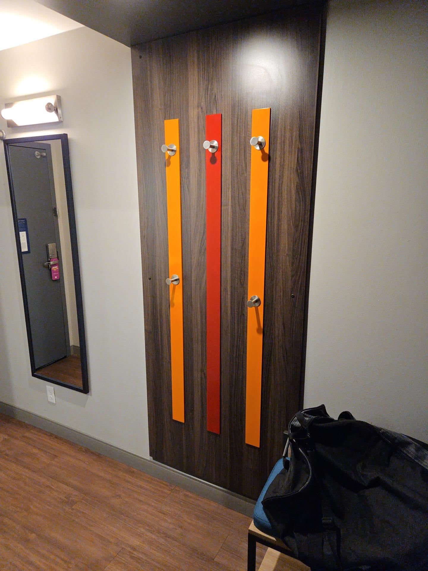 They have coat hangers directly across from this I don't know anyone who needs to hang that much clothing