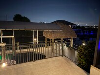 Tiki and Boat Dock at night