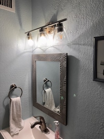 Missing lightbulbs in multiple light fixtures.