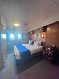 My room with 2 port holes with an adjoining room with twin bed