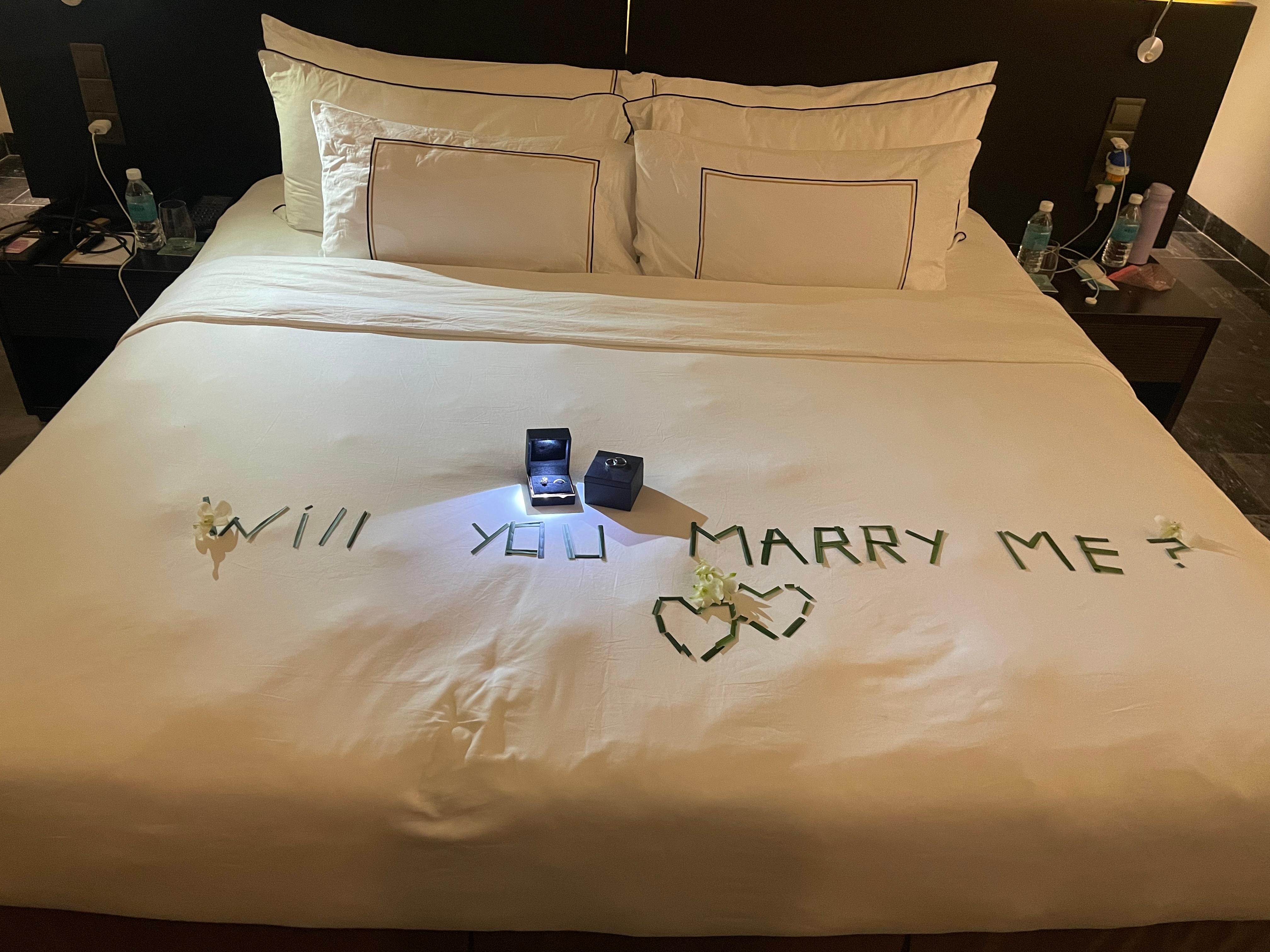 I initially planned to propose on the private beach in front of the resort, but due to the bad weather, I asked the hotel staff to help create a romantic setting in our room instead. When we returned after dinner, the room was beautifully decorated w