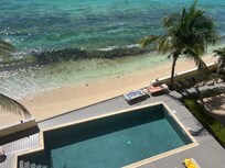 Sitting on the edge of pool deck gives you all the advantages of being by the ocean without getting sandy!