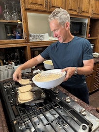 My brother cooking a pancake breakfast on our first morning.