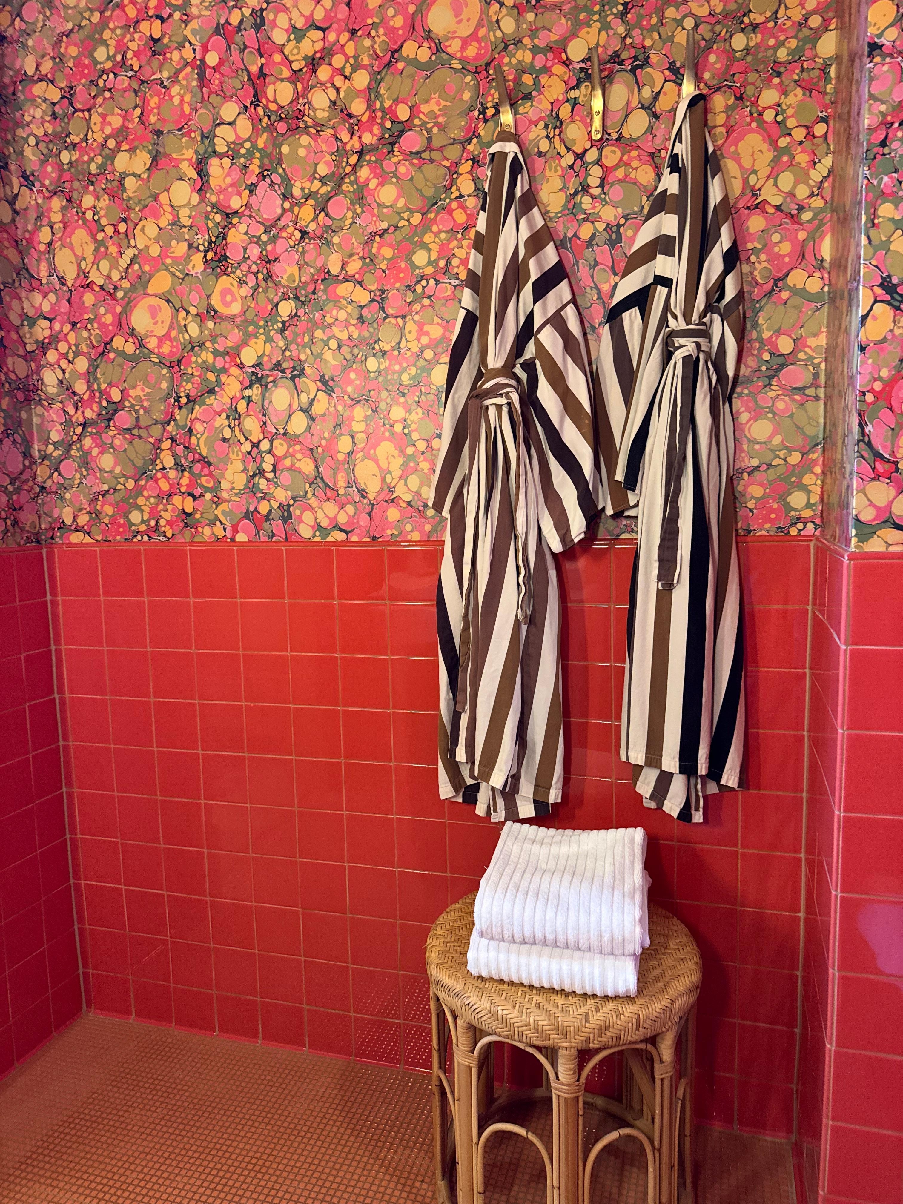 Cutest pink bathroom with great water pressure and adorable robes.