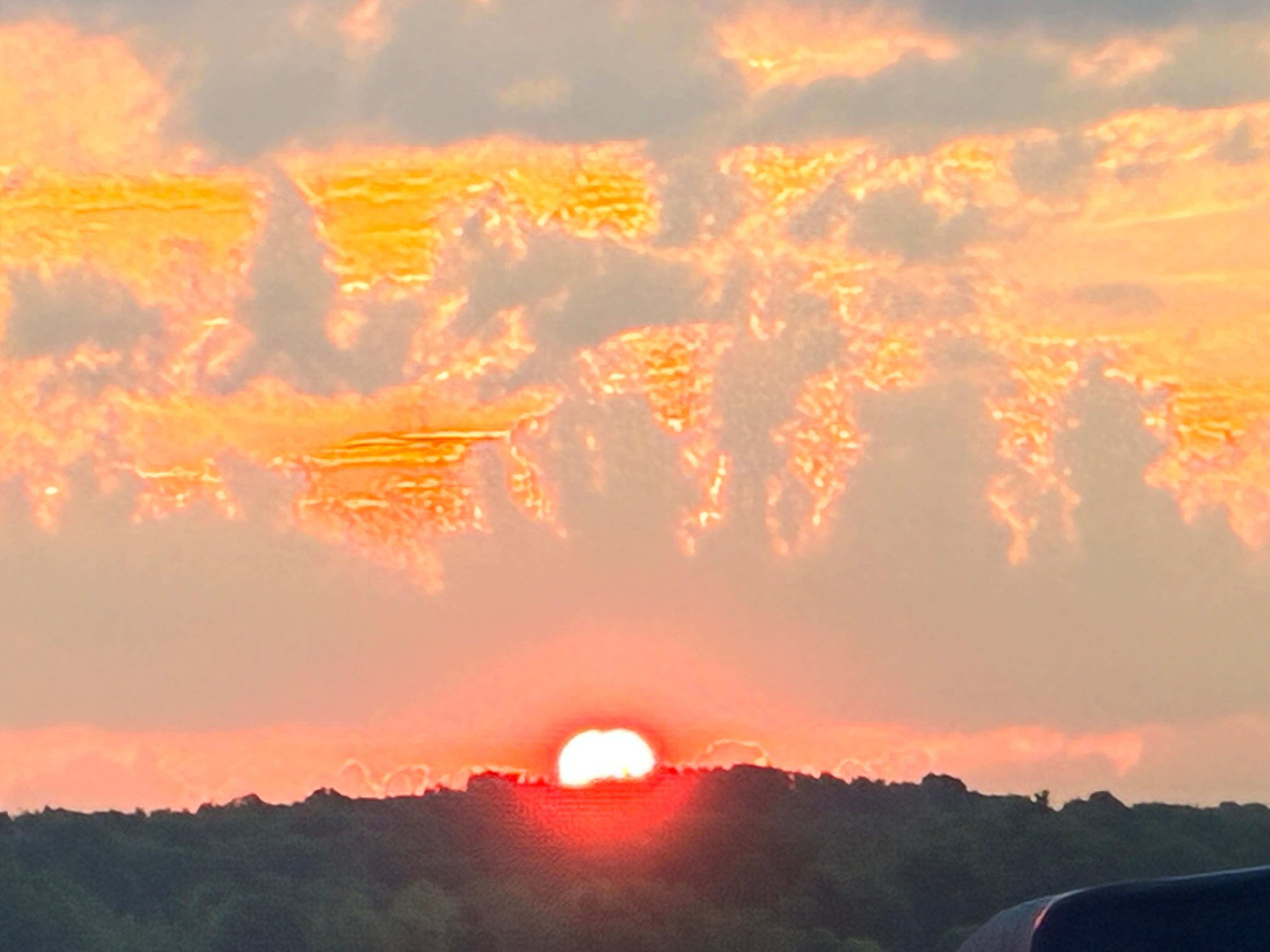 Sunrise from the living room of lake house