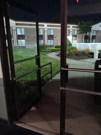 Open door to pool area with unlocked poolgate
