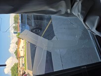 The front windows was held together with tape.