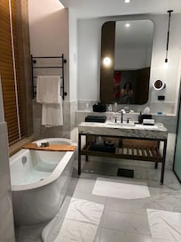 Bathroom suite, shower and toilet to the right side of room. Spacious and high window with privacy blinds to the room