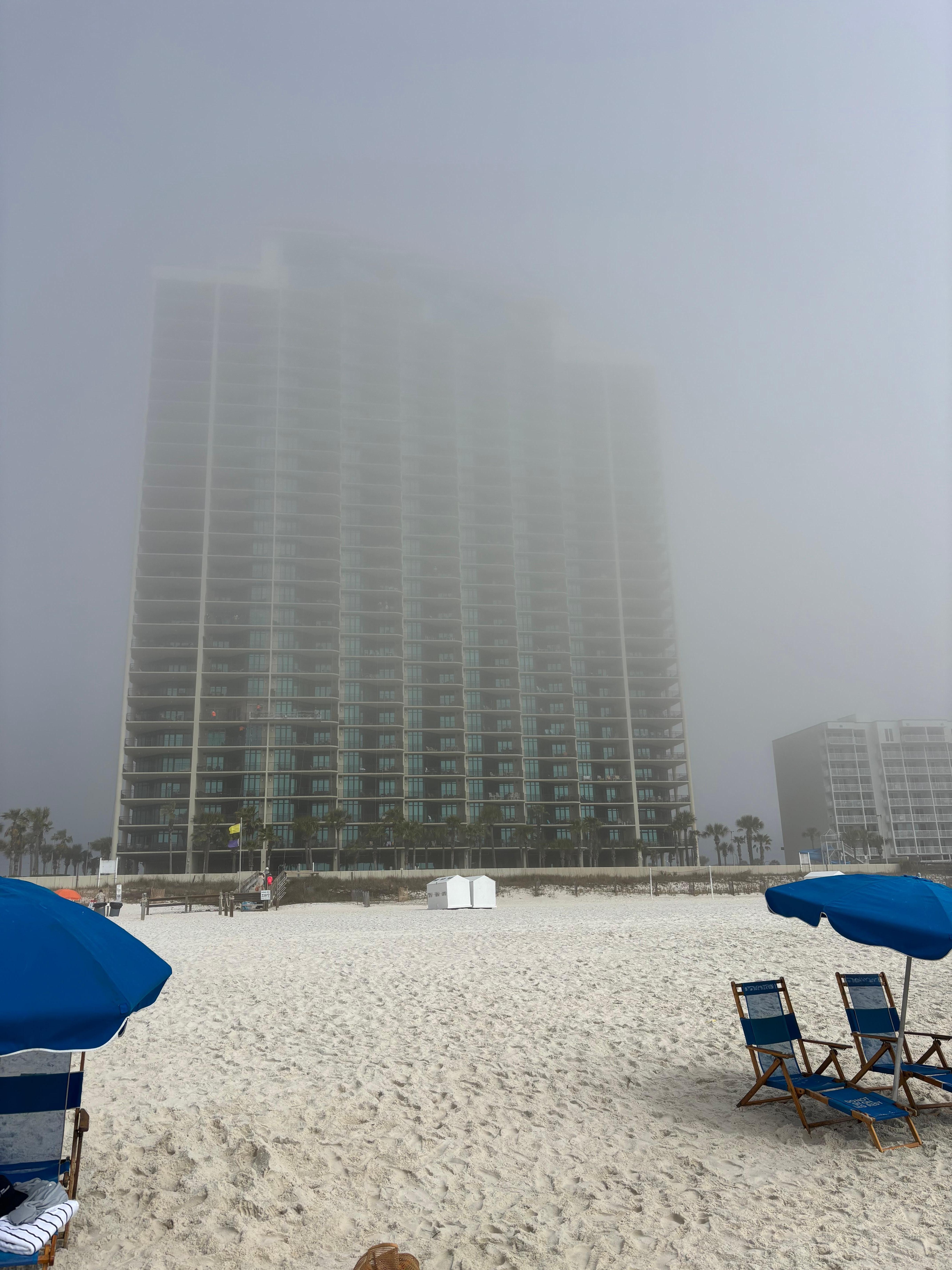 Beach view looking back at condo on a foggy morning 