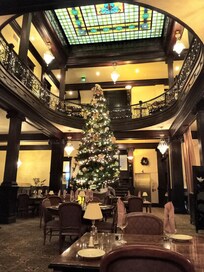 Christmas decorations in the restaurant. Notice the stained glass ceiling.