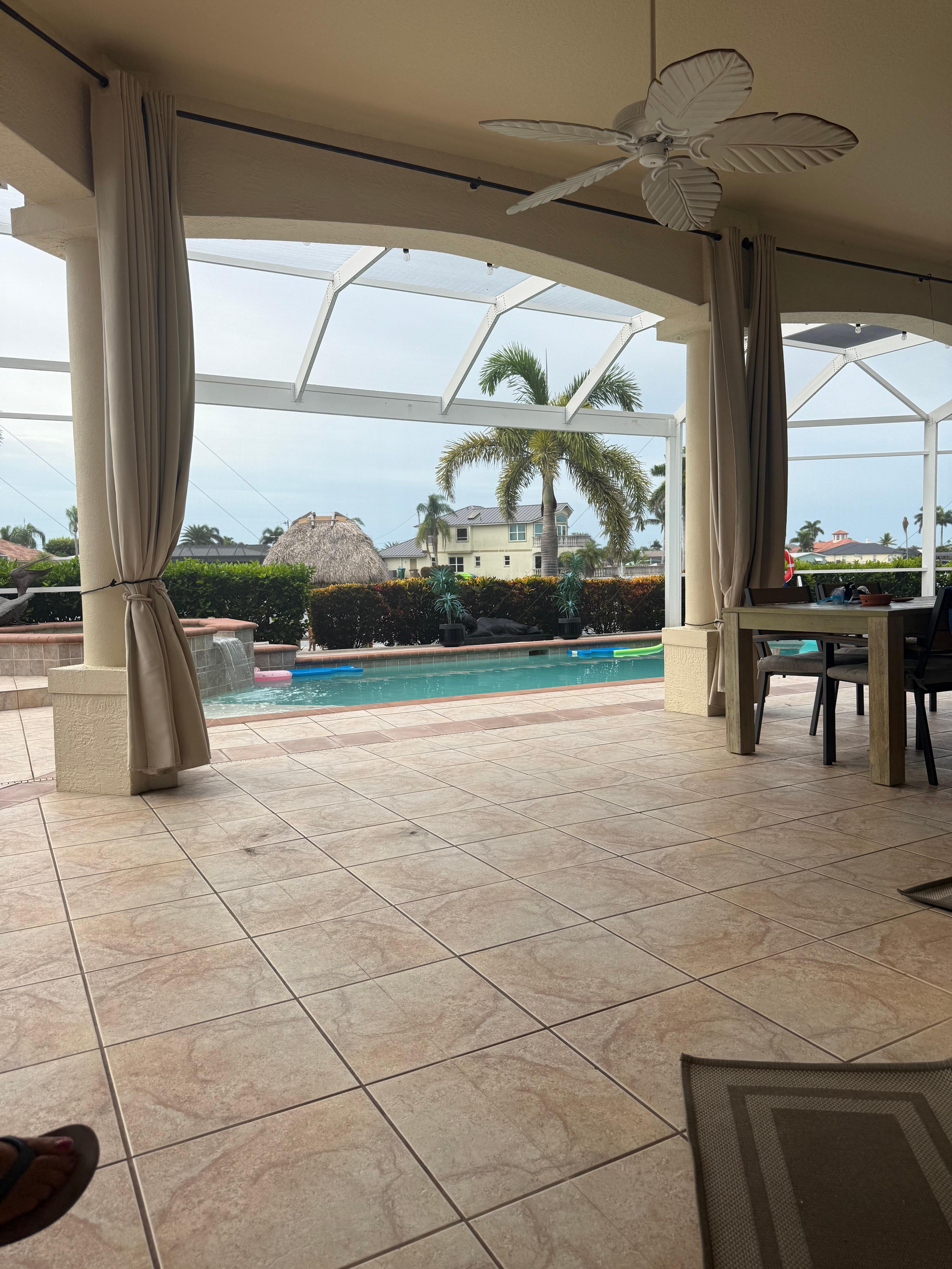 View from inside screened in pool area 