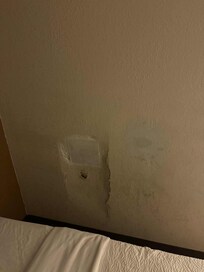Horrible attempt at patch and even had drywall on floor.