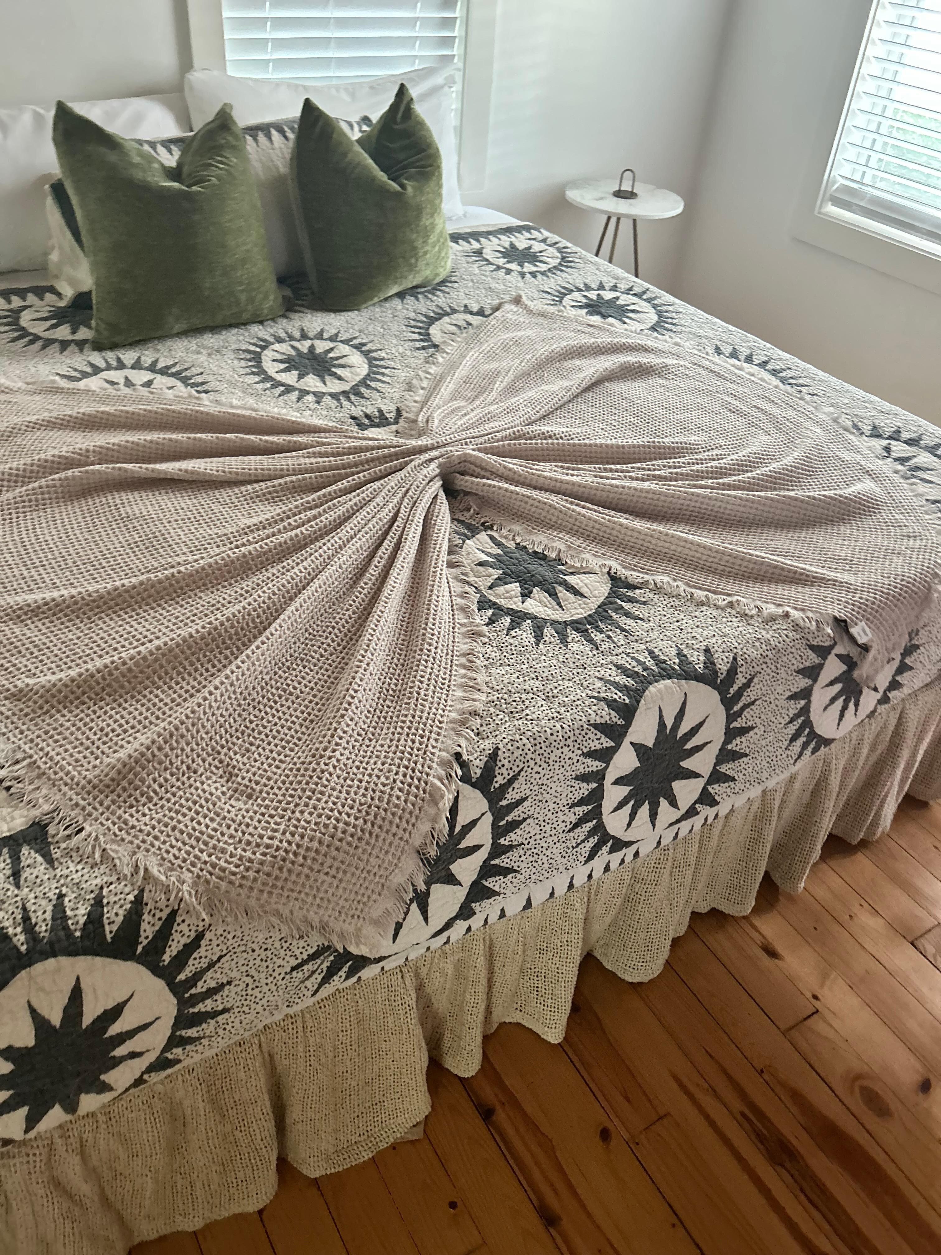 King size bed with cute bow throw 