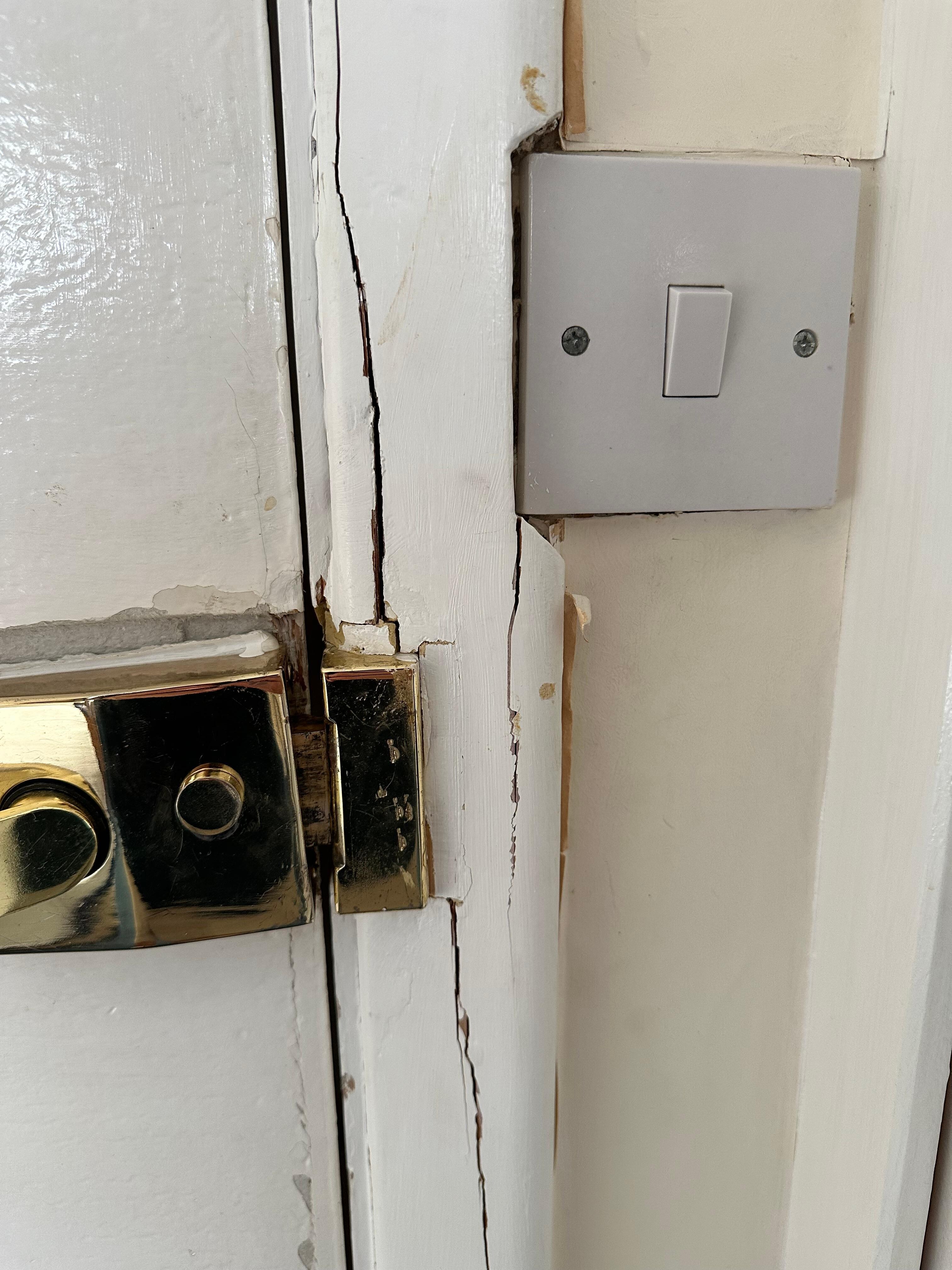 Broken in and poorly repaired door