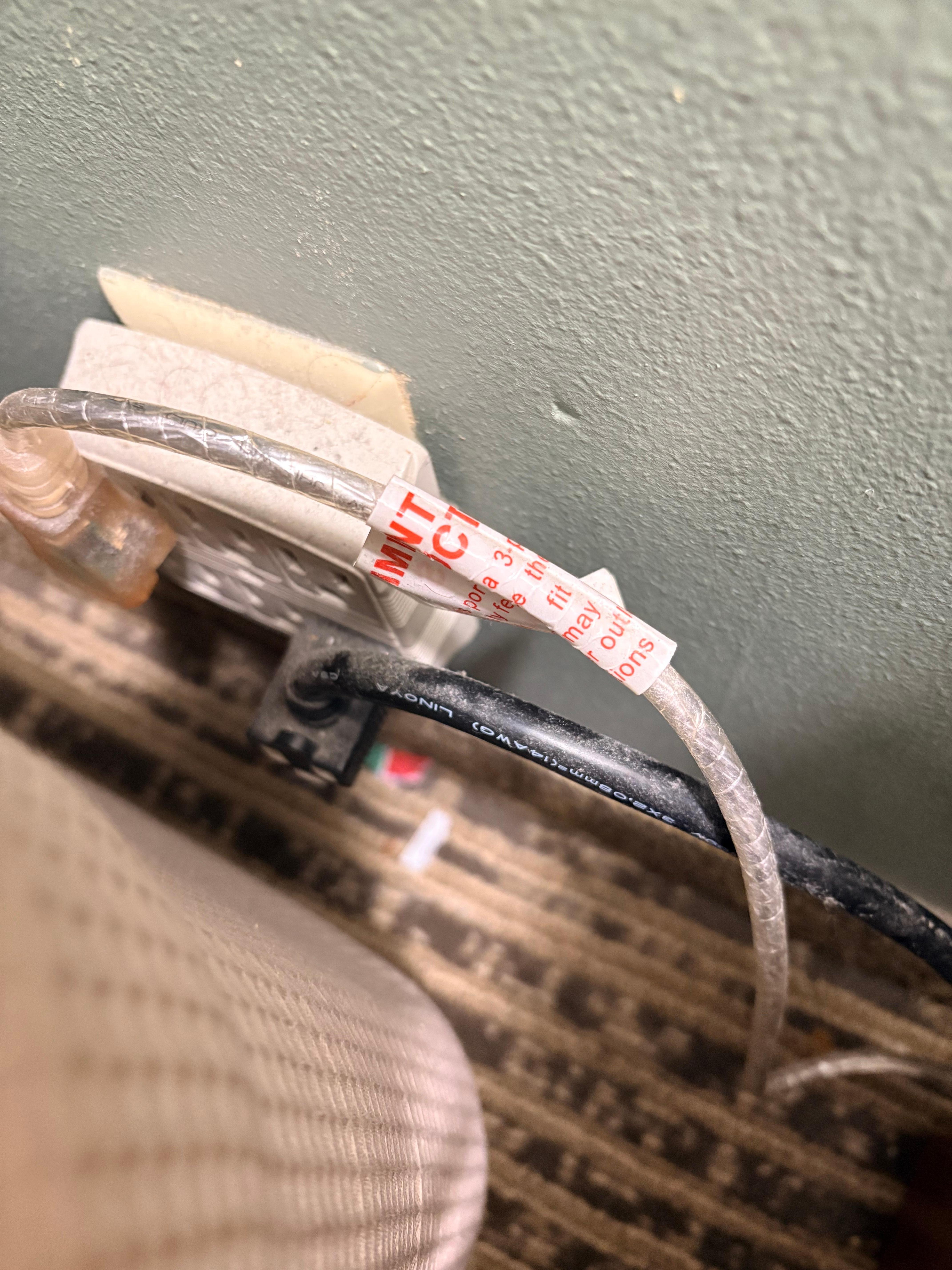 Dust and hair on the outlet and cords and dust on the bedside table and tv stand/dresser. 