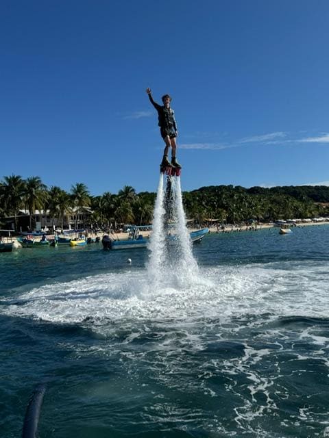 Our teenage grandson, Brett on the fly-board.