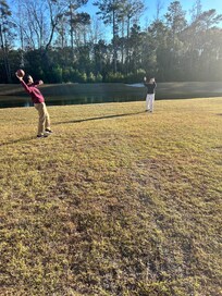 My nephews throwing the football in the backyard.