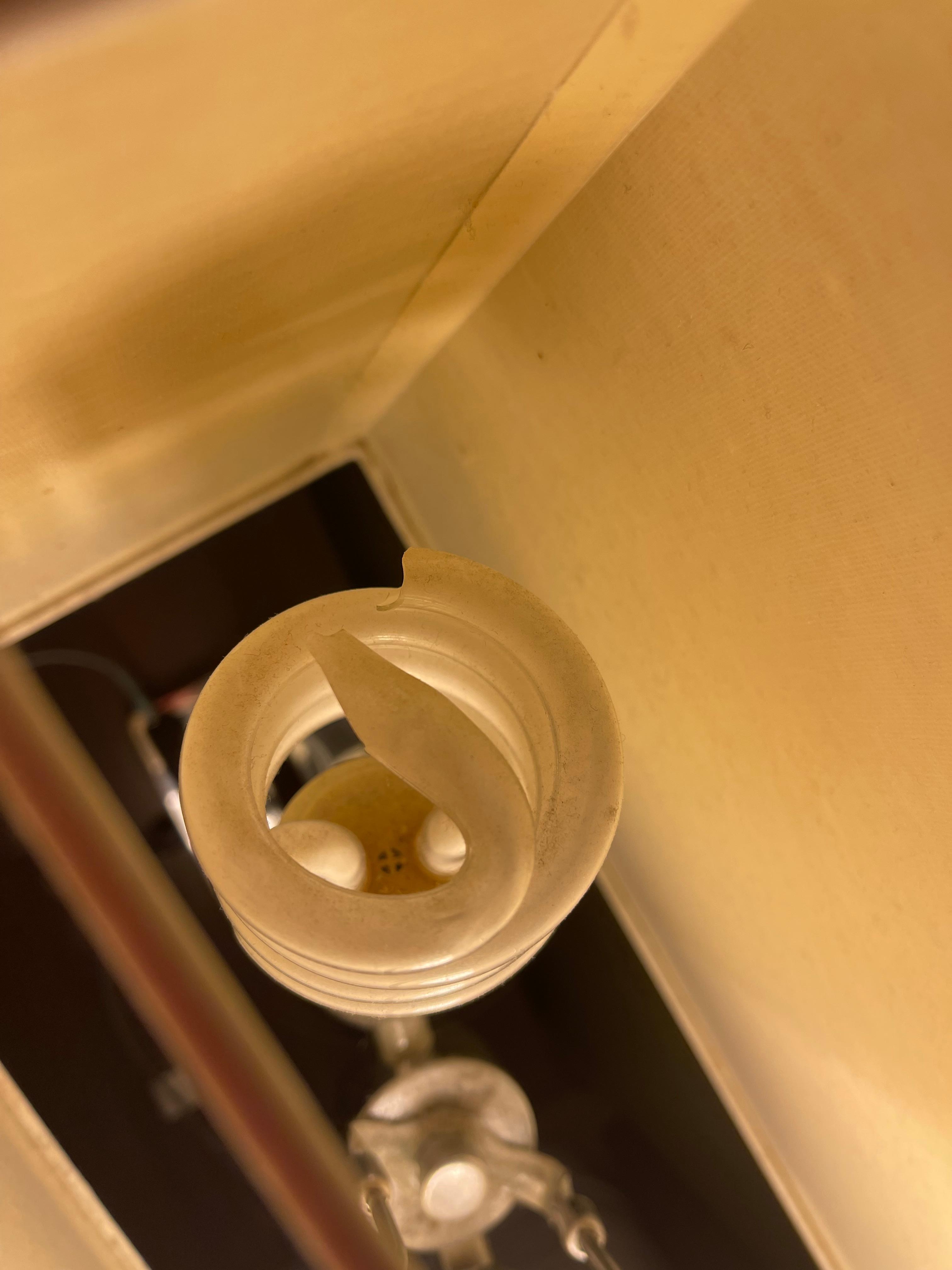 Broken light bulb left in light socket 