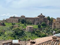 View straight ahead from balcony. There is a green space nearby down below (Orto dei Pecci)