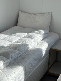 One side of the two small bedrooms. You could not open the door all the way because it hit the other bed.