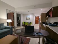 Room interior, with an extra bedroom and bathroom not pictured. Desk rolls to wherever you need it -- so convenient.