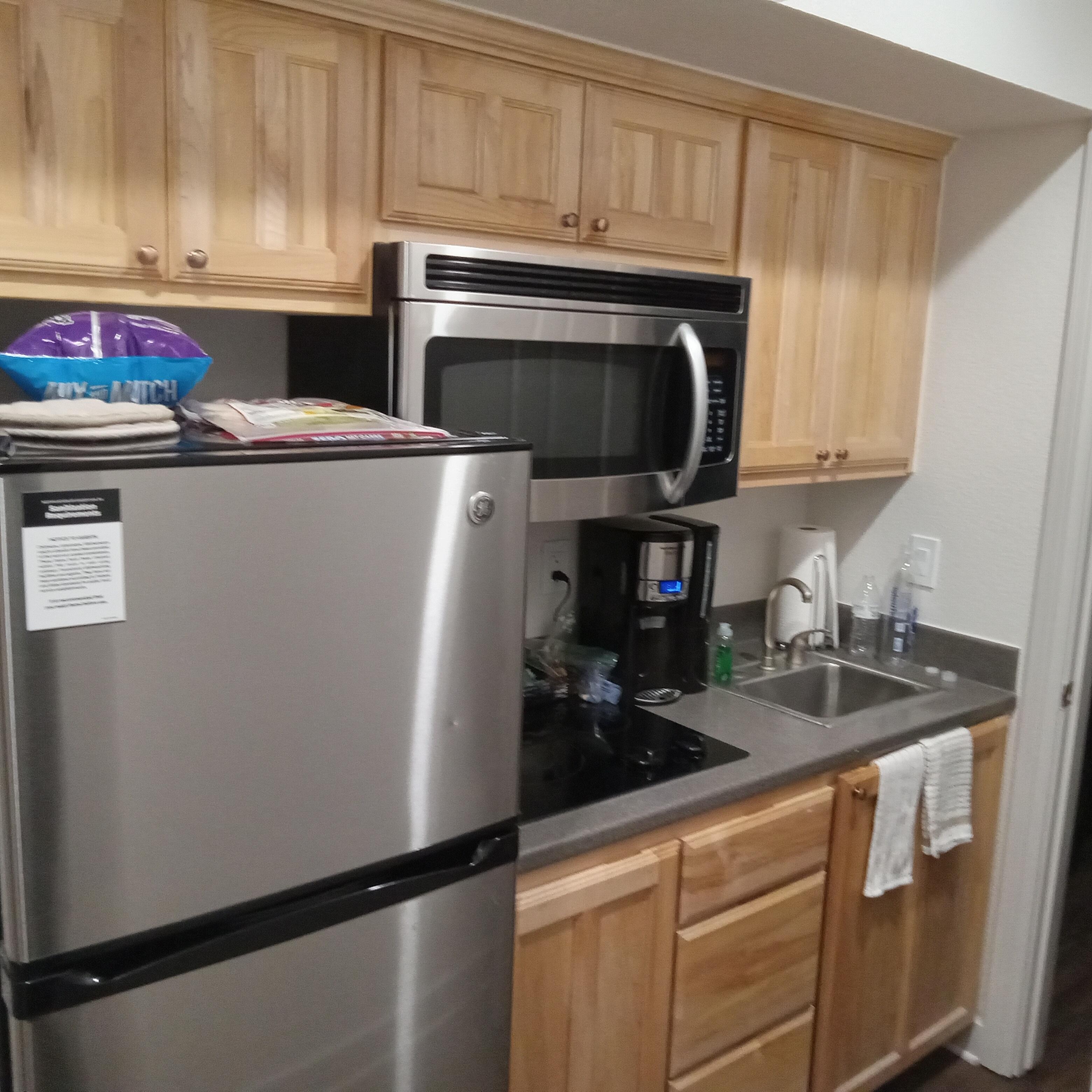 Large fridge, micrwave and stovetop.