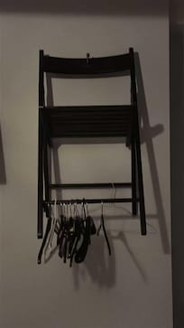 Chair on wall clothes hanger
