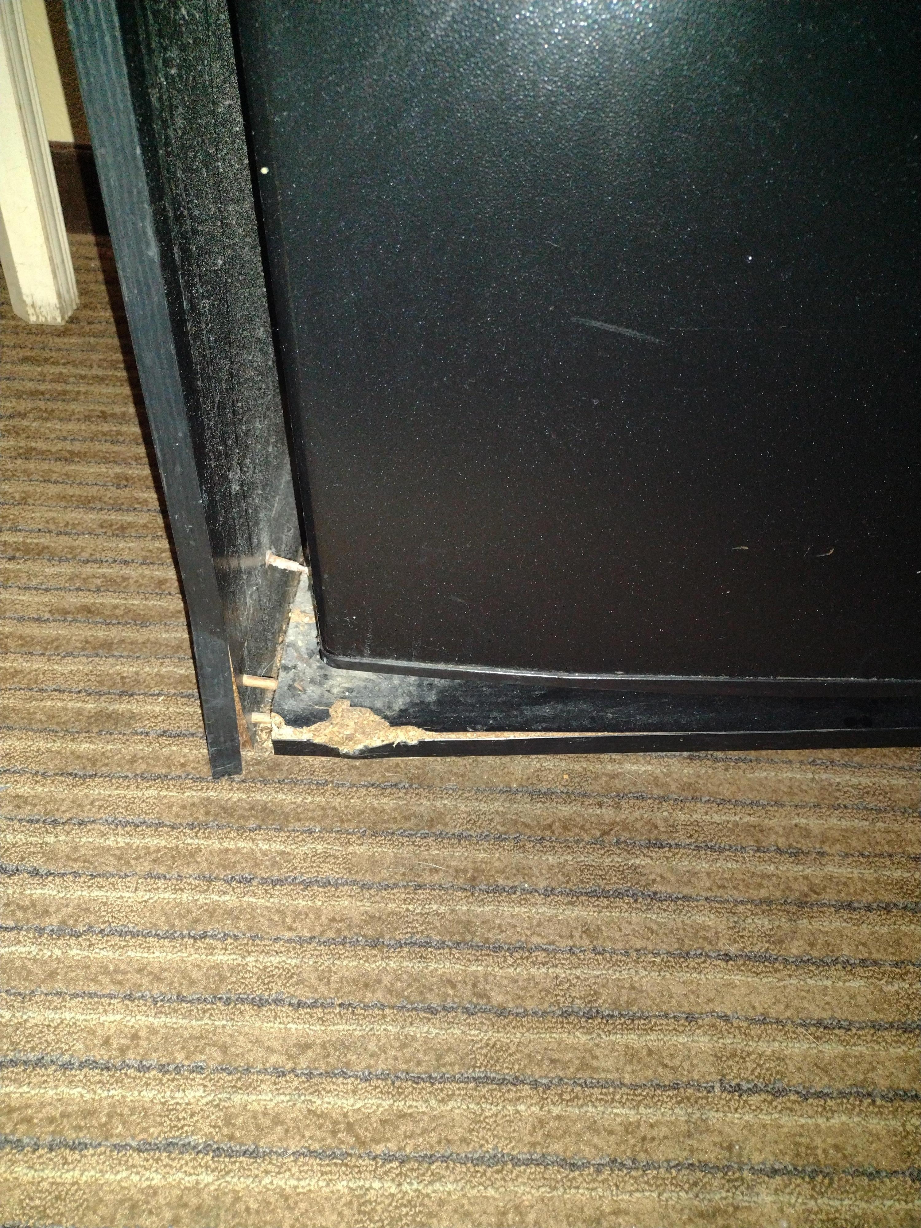 Fridge is not level due to damaged cabinet