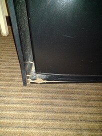 Fridge is not level due to damaged cabinet