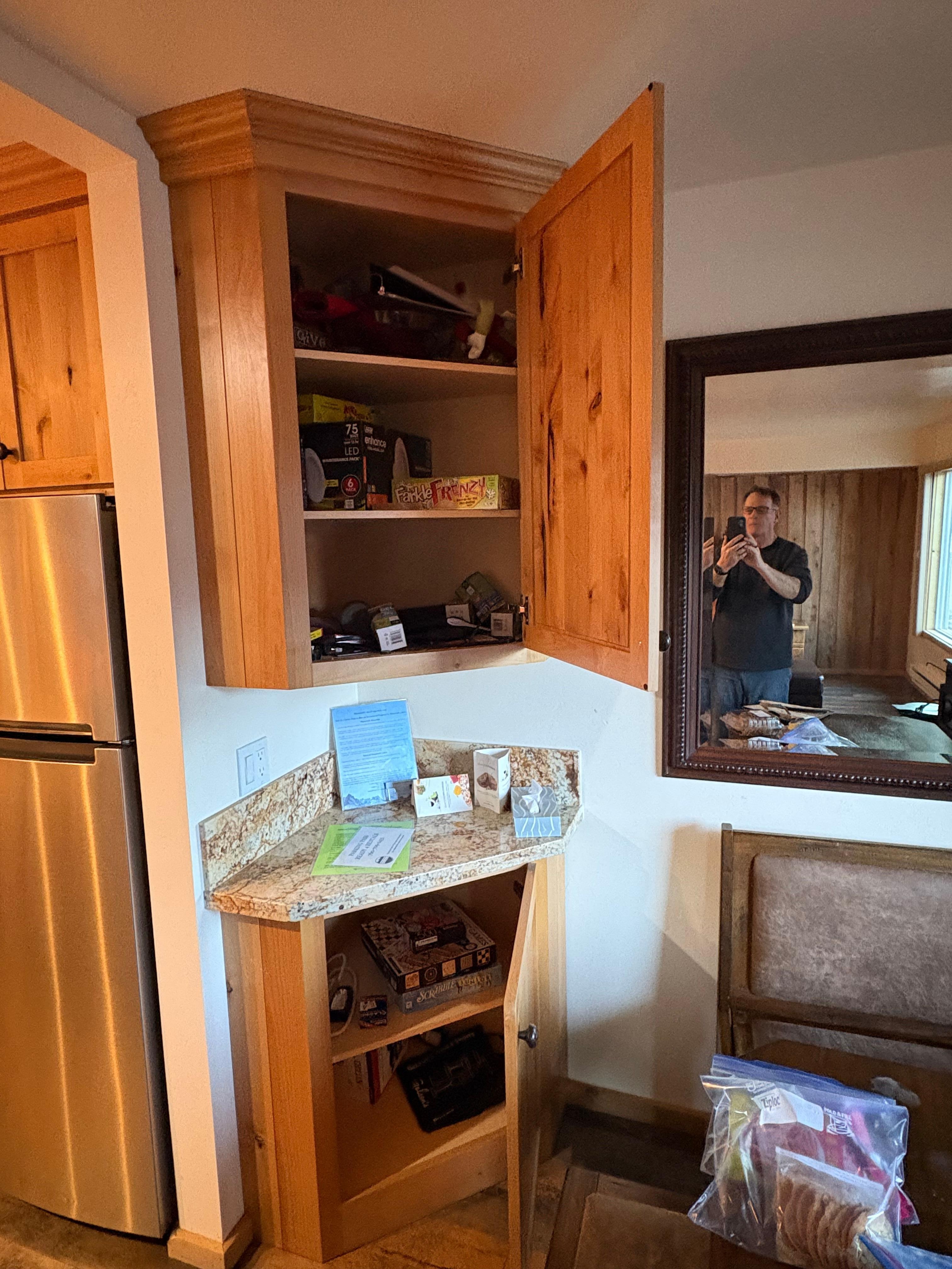 Disorganizedcabinet in kitchen area