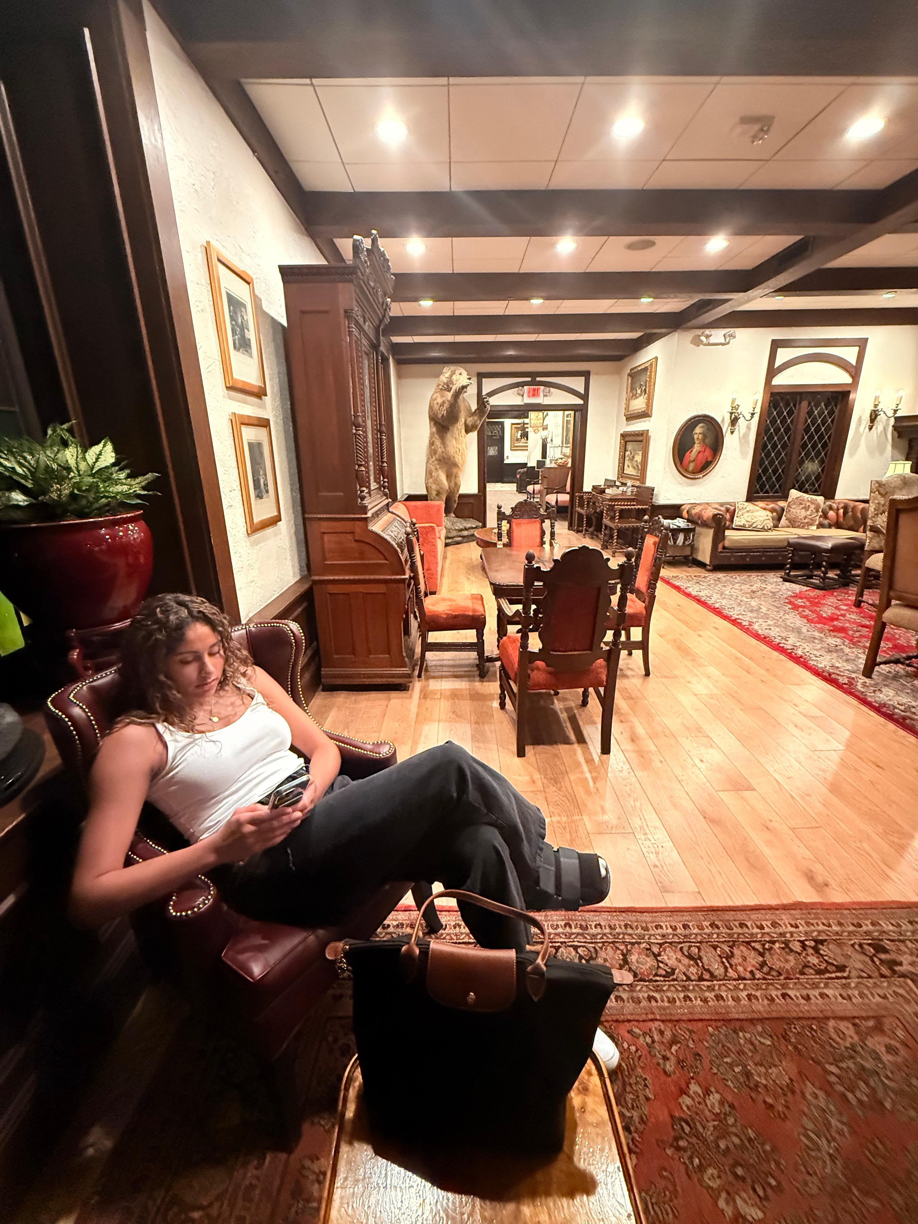 Lobby with warmth including comfy chairs and games to play. 