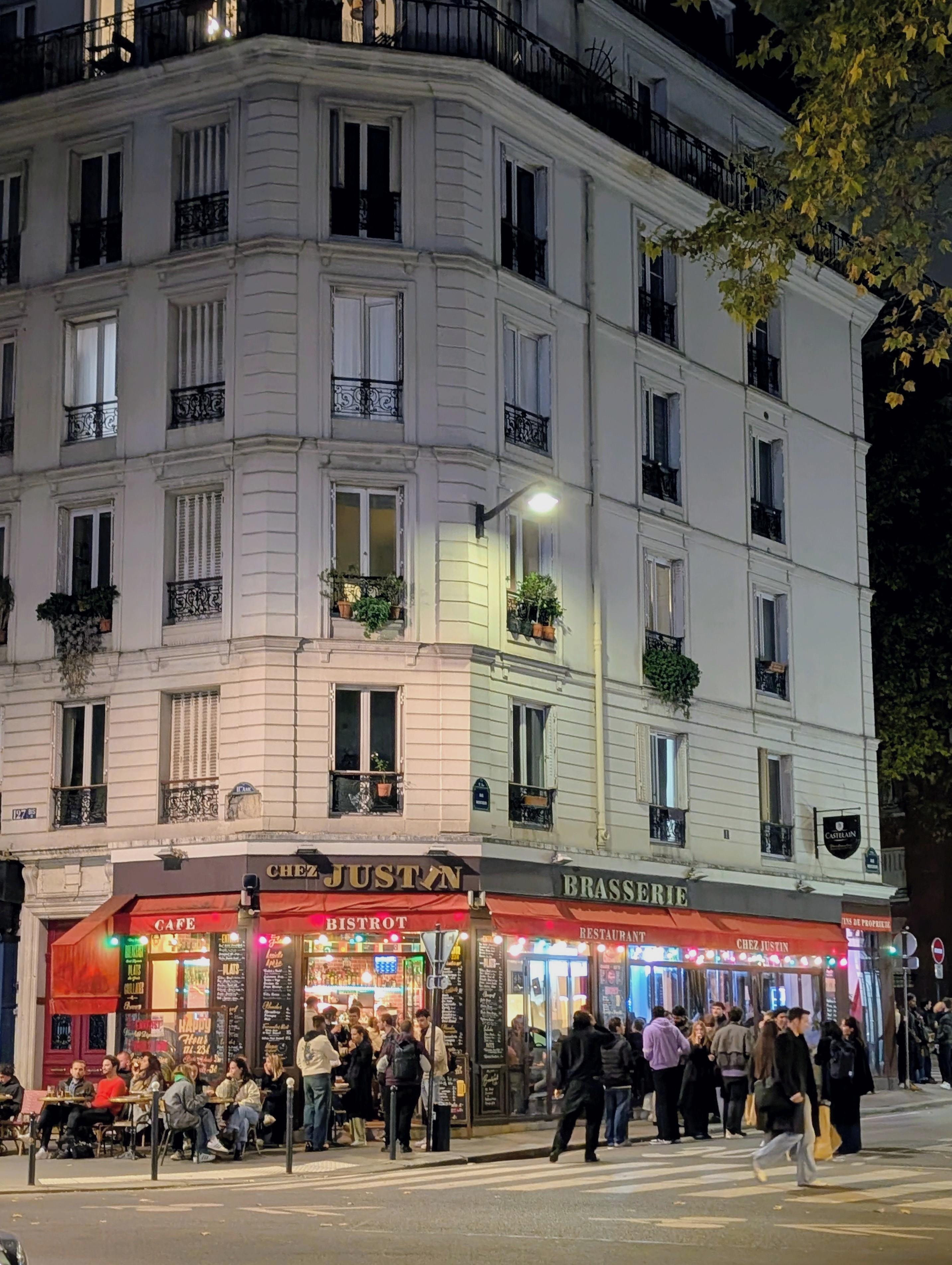 Chez Justin at base of building. Good food & friendly group...busy at night. 4 th floor corner unit ( straight on)